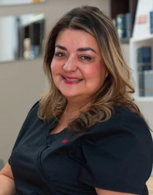 Smiling Woman in Black Top at Weight Loss Clinic Near Me